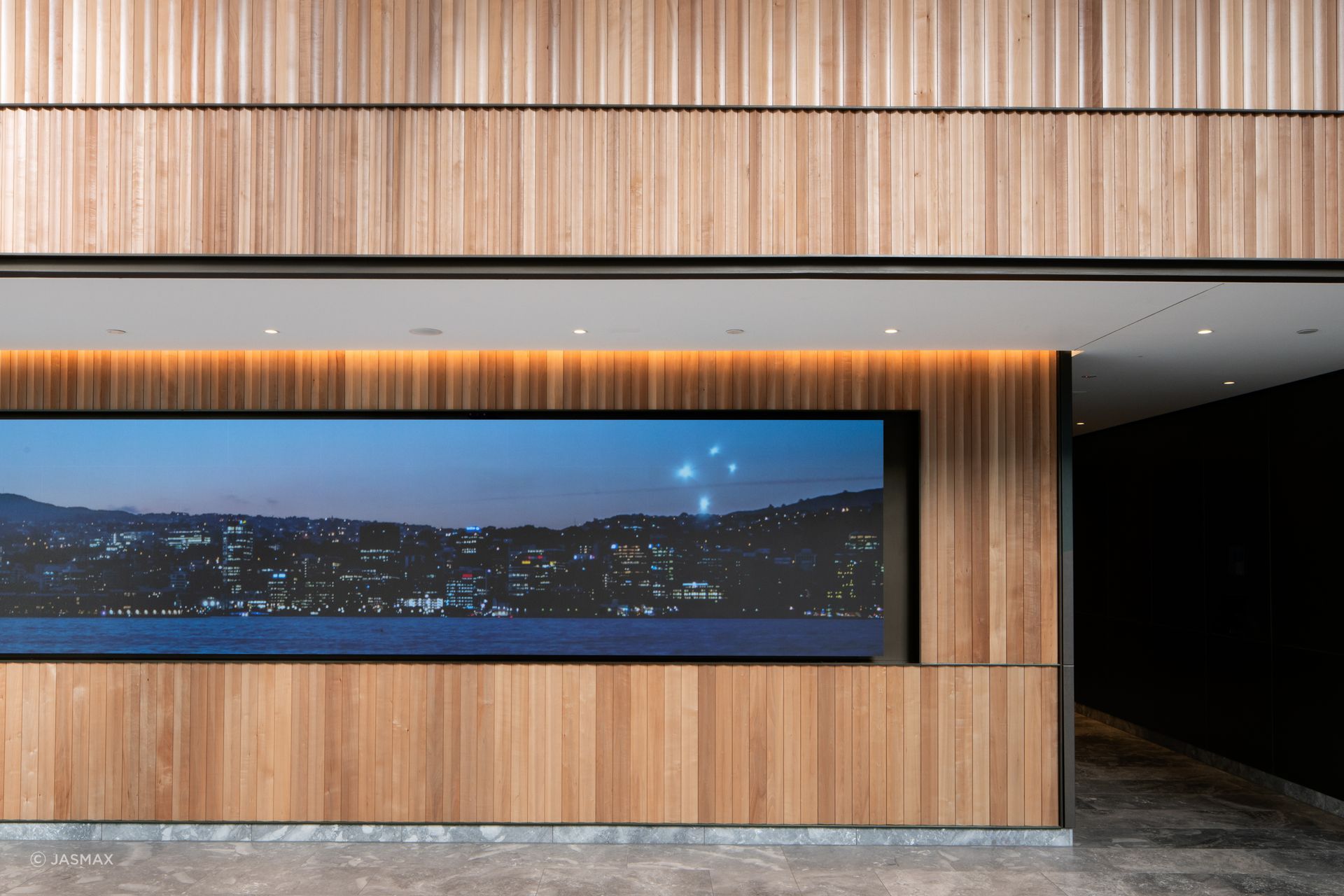 The interior architecture of the public spaces includes timber, brass and marble finishes.