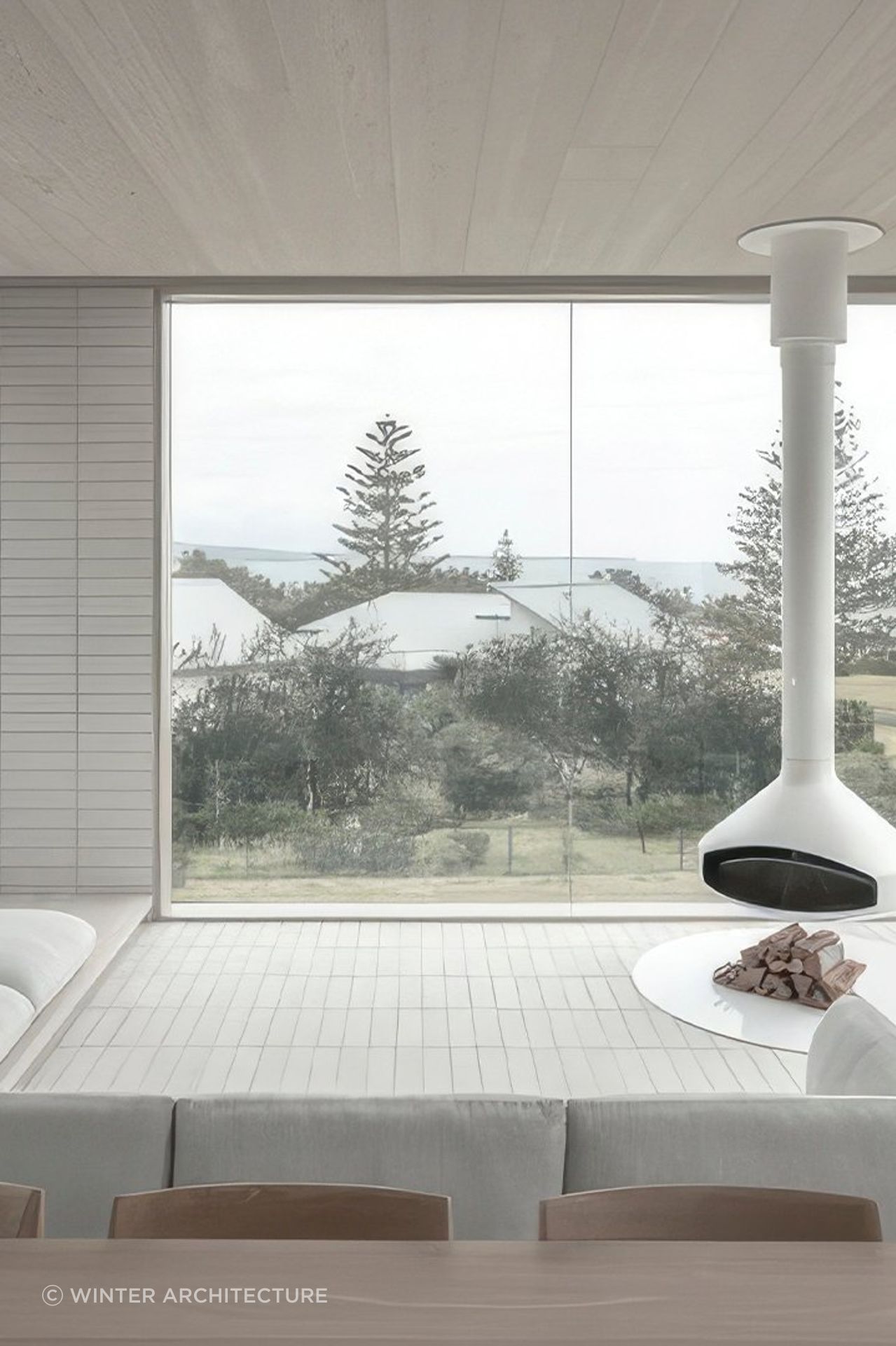 Interiors feature a carefully curated palette of white surfaces, soft sand, timbers and robust brickwork.