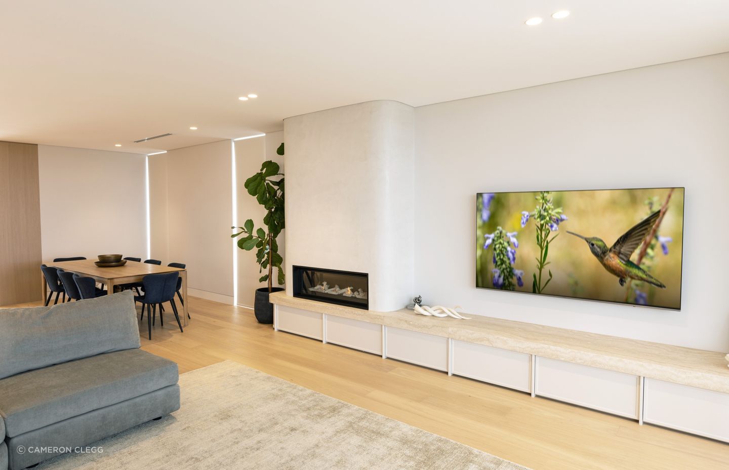 “On this ground floor, above the basement, you have the guest bedroom, powder room, living, kitchen and dining, and an elevator that connects the three levels.”