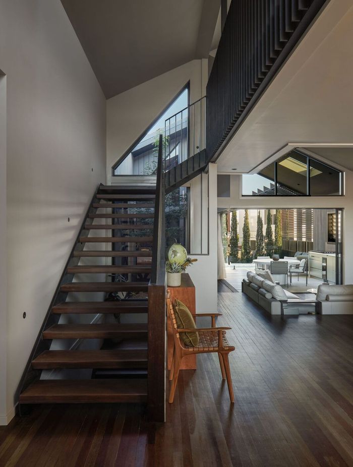 Vertical connectivity is achieved both visually and physically via the open riser stair and central atrium allowing an unobstructed line of sight between the living area and loft, making the space feel more expansive.