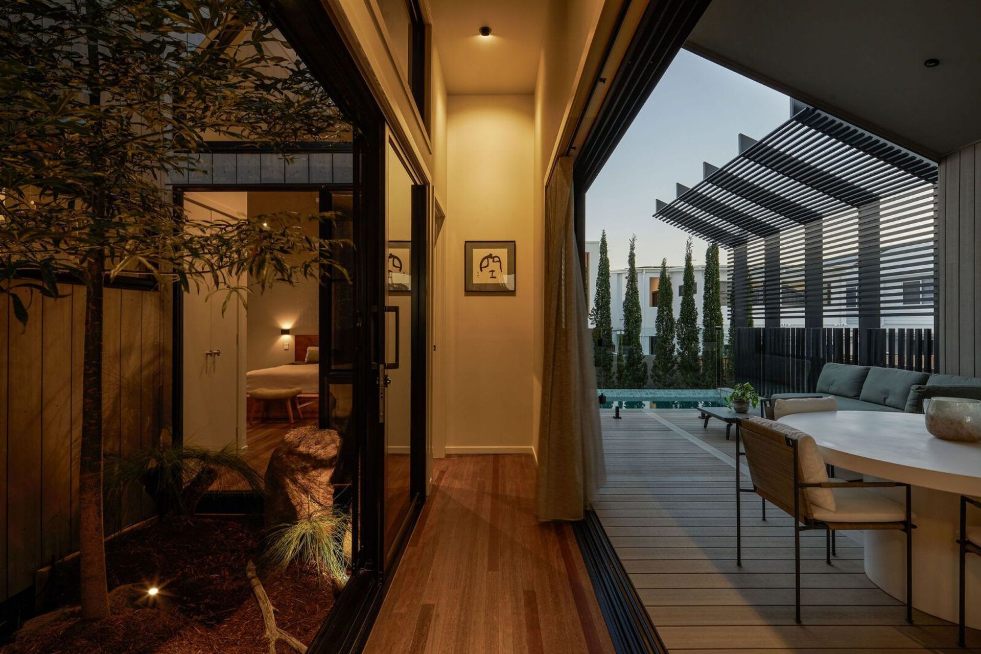 An extension to the living area of the home, the deck and pool area seamlessly connects with the interior.