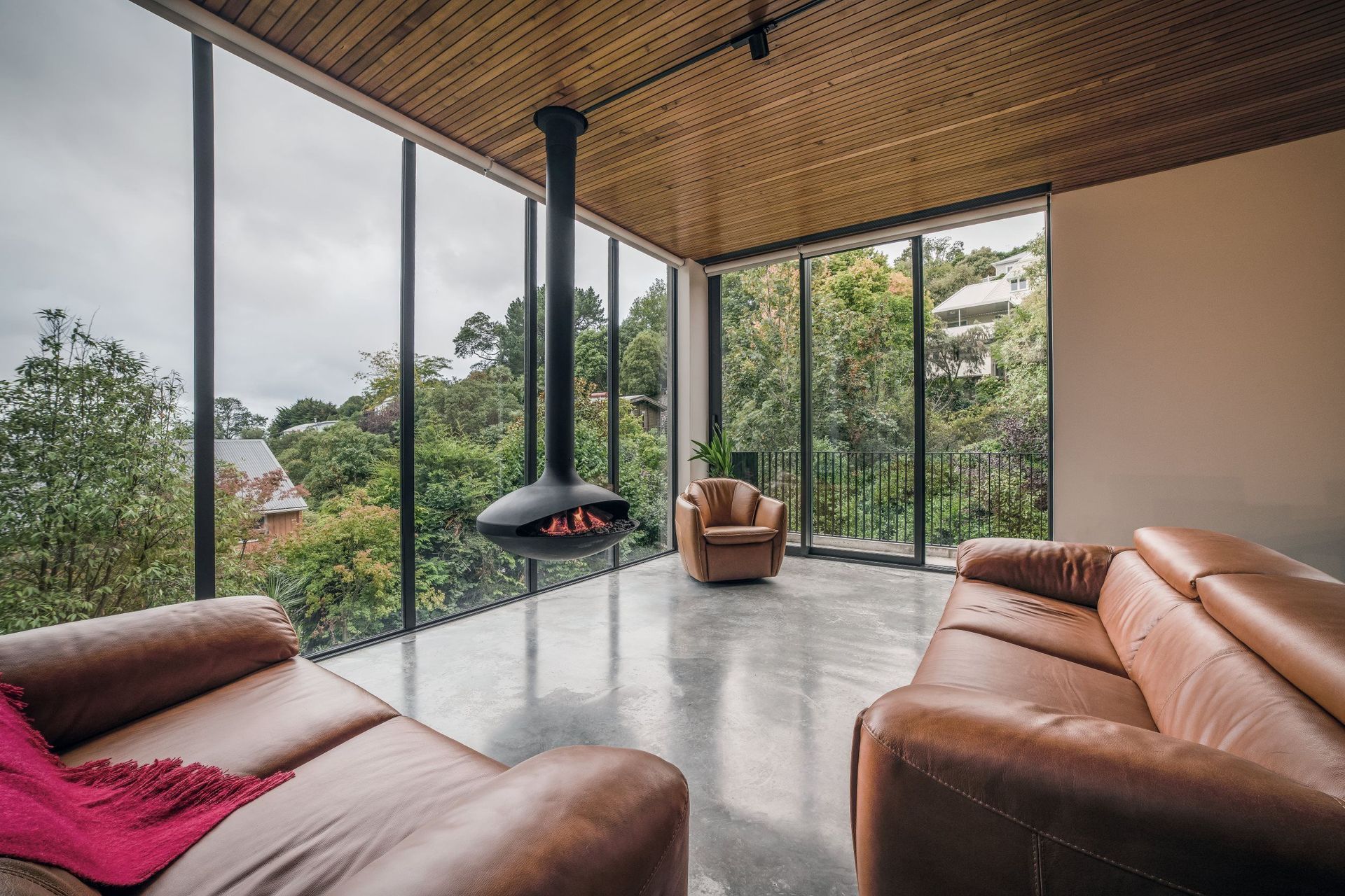 The living room offers warmth and panoramic views.