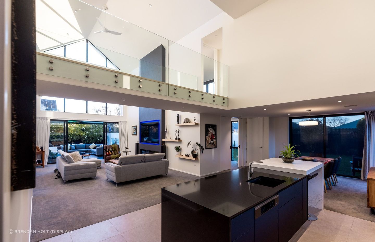 A standout feature of this project is the footbridge that provides a unique entry to the master suite.