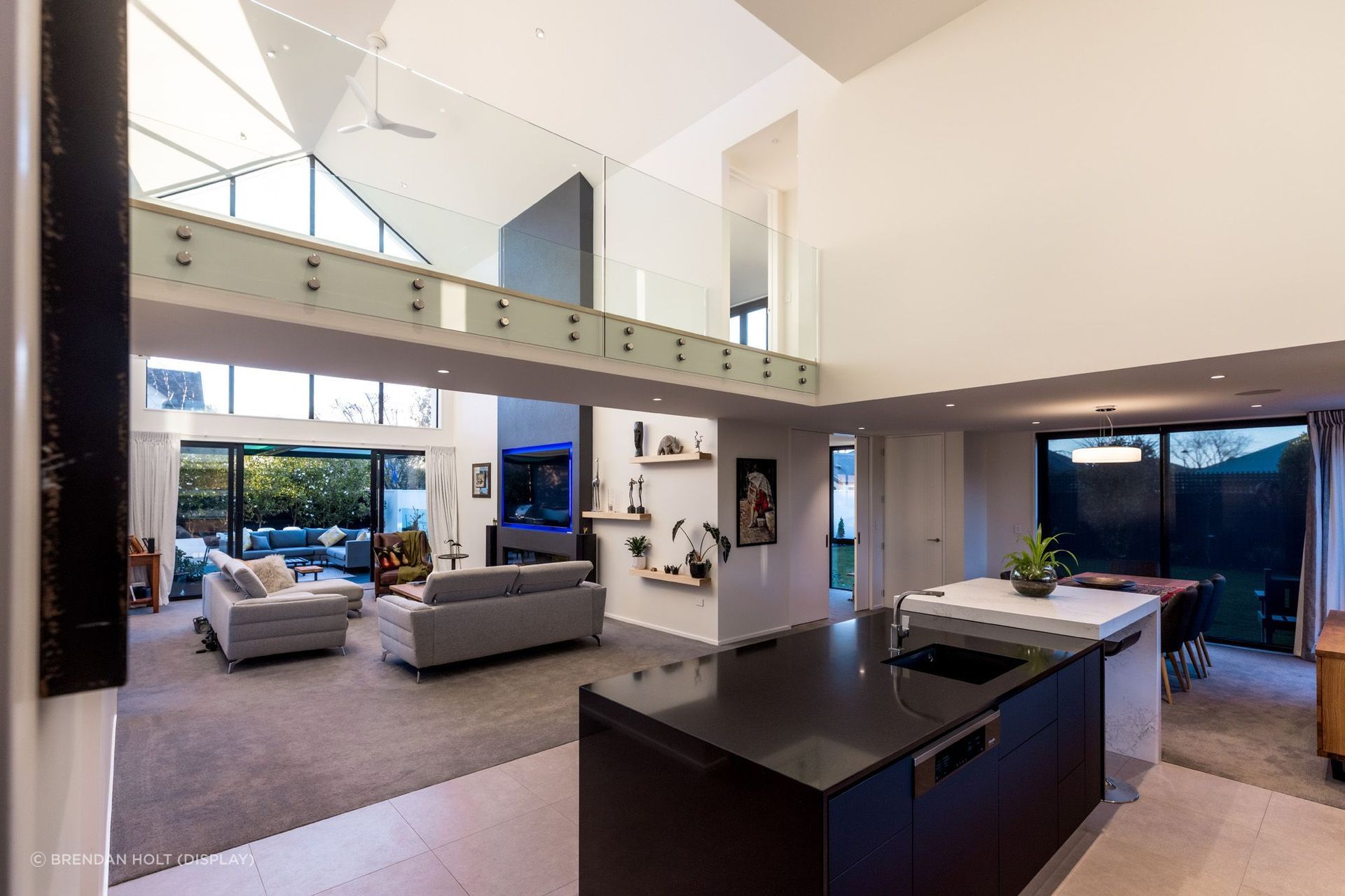 A standout feature of this project is the footbridge that provides a unique entry to the master suite.