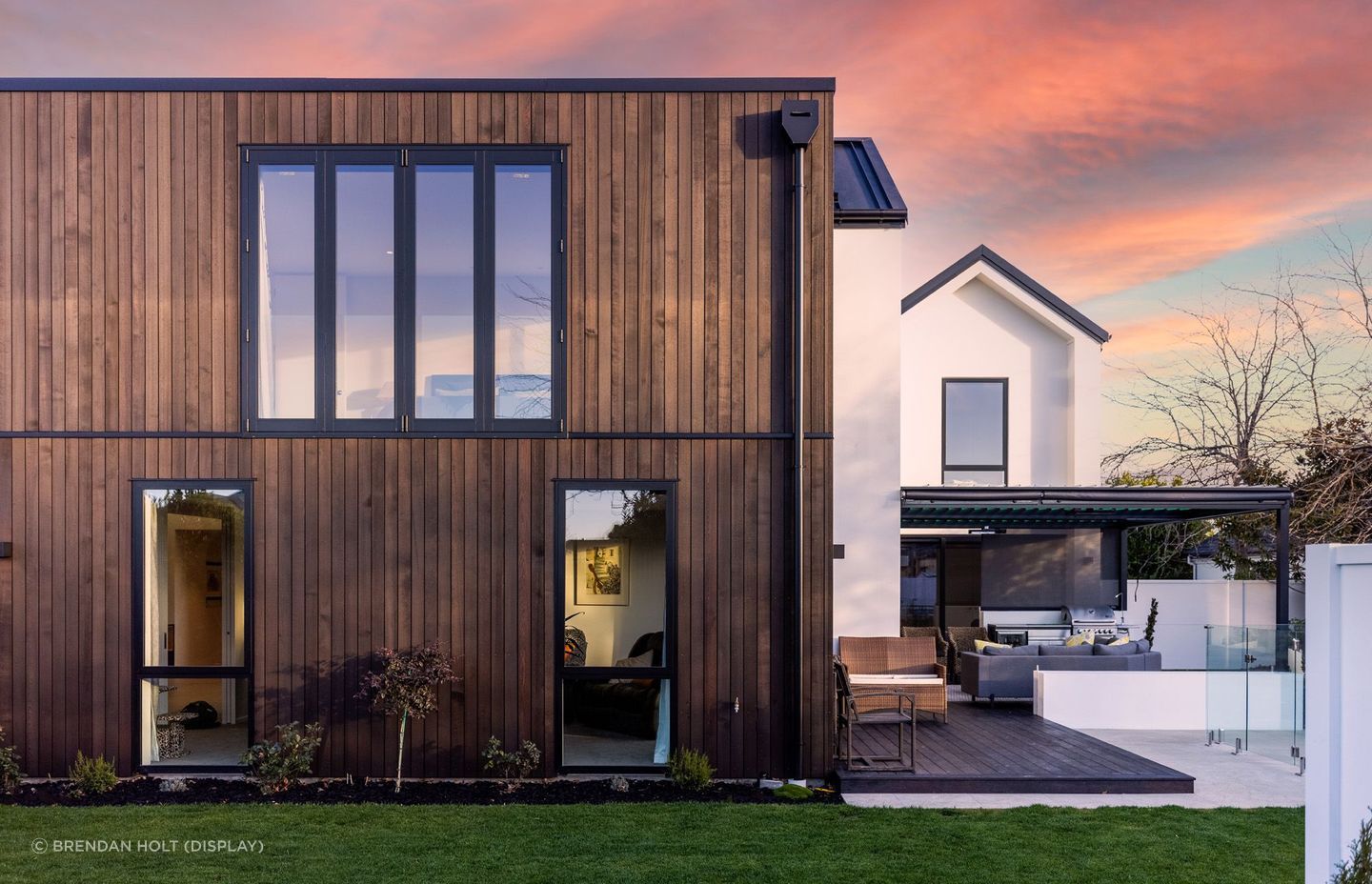 The exterior of the house is a contrast of colours and materials, including AAC panel, cedar and Colorsteel Eurotray.
