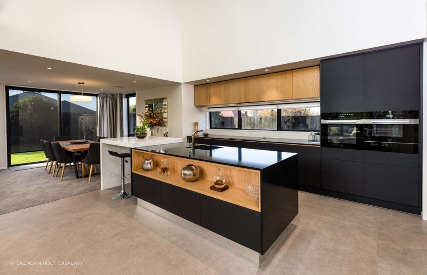 Similar to the home's exterior, a combination of contrasting materials have been used for the kitchen.