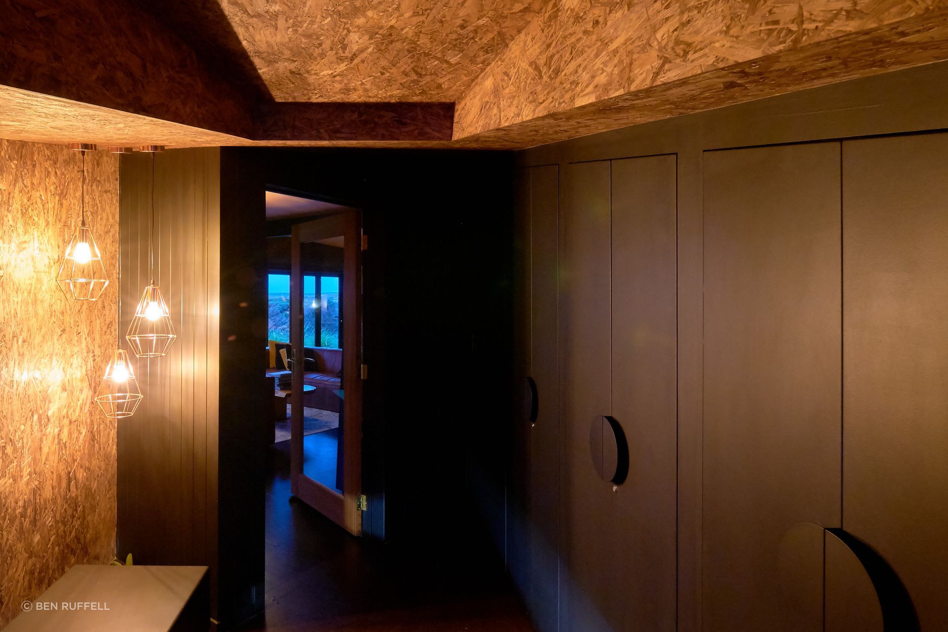 "I tried to strip it all back. Low material, low wastage, low heat loss," explains Farrell. "The walls are pre-fabricated SIP panels. I didn't overline them, so everything inside relates to the form that it's in."