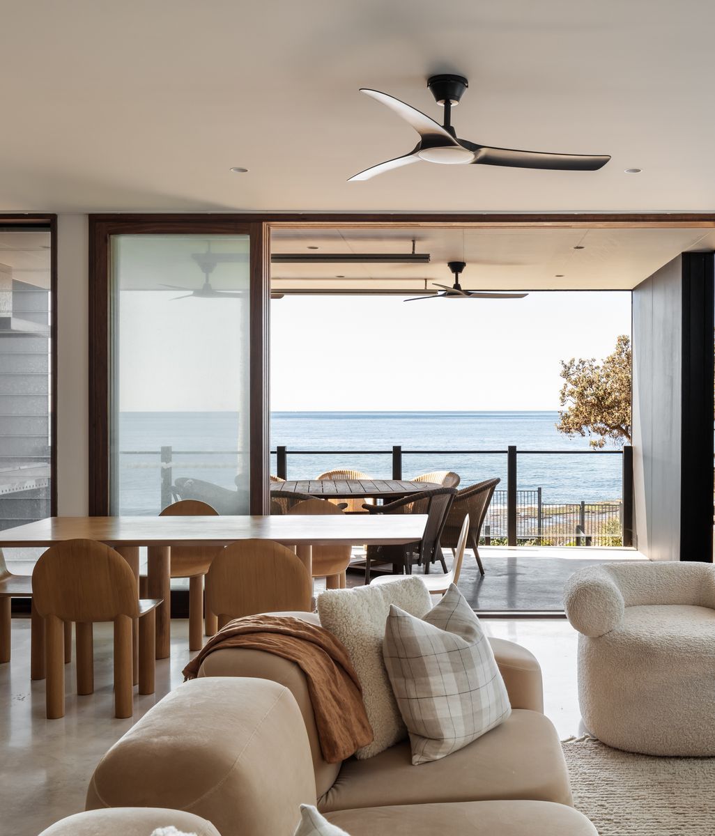 This striking modern home captures sweeping ocean views through an ingeniously compact layout