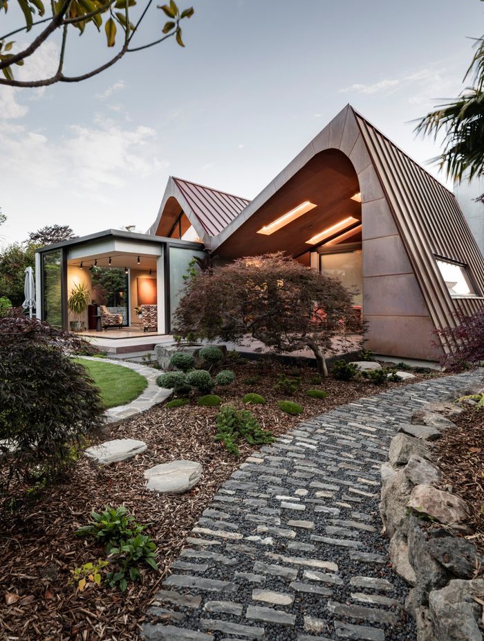 Landscaping was designed by Kamo Marsh. In the outdoor living area, the skylights also have LED lighting, says Craig. “It feels like they glow even at night.”