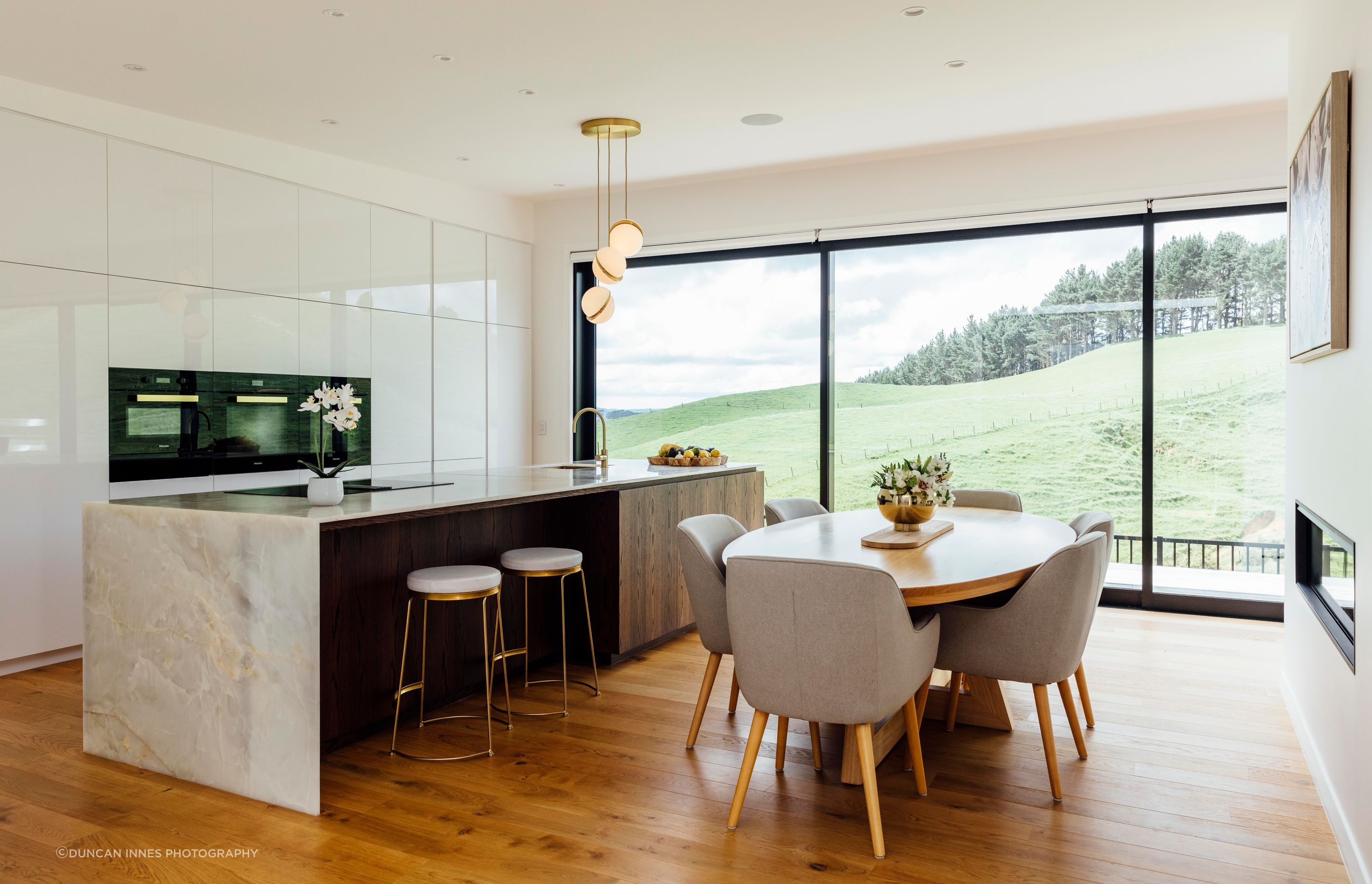 David Reid Homes collaborated with Cube Dentro and the homeowners on the luxe interiors. “Raked ceilings through the lounge and kitchen area and through into the master bedroom follow the roofline,” says Brendon.
