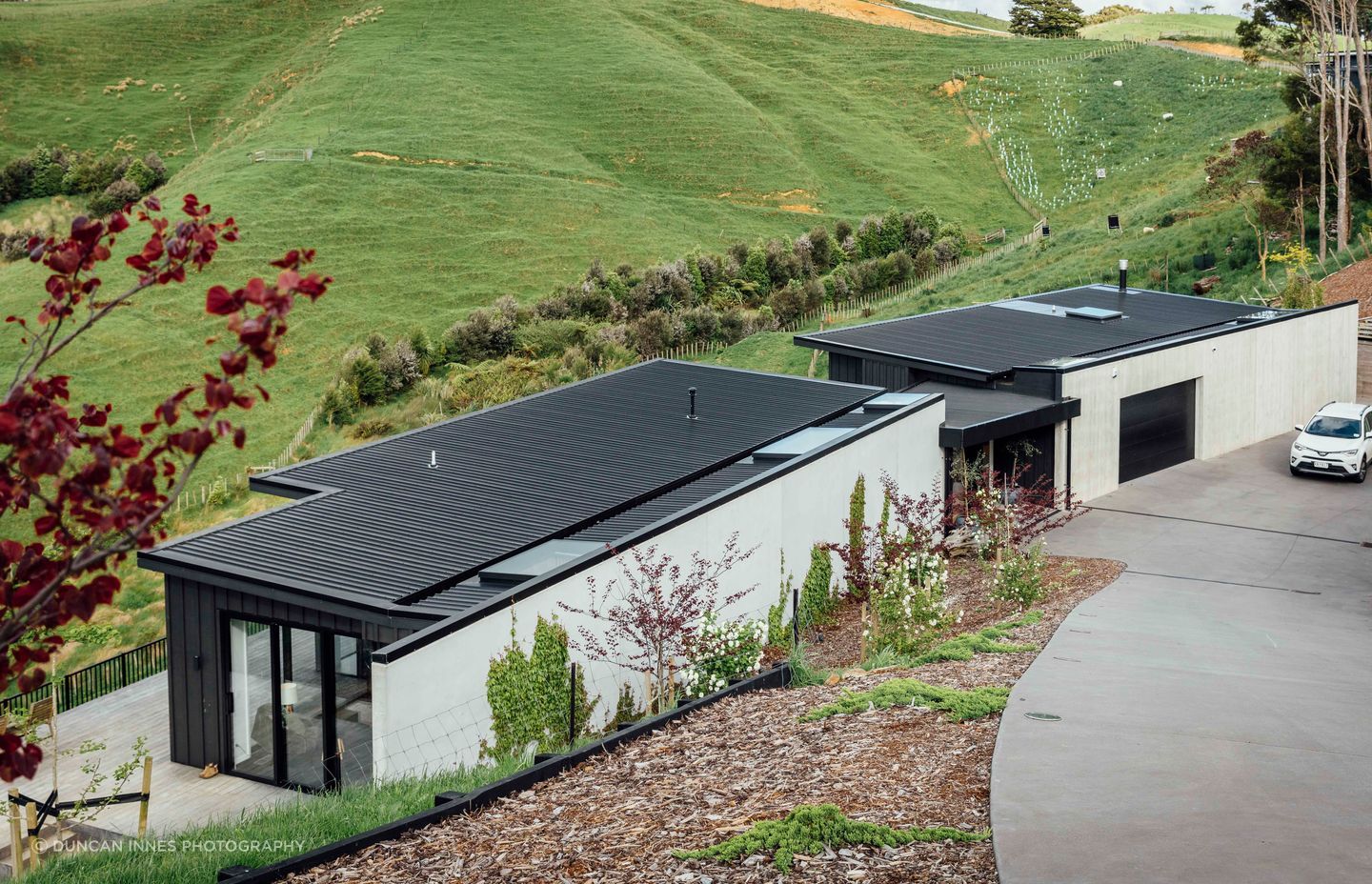 The house in Auckland’s Bombay Hills designed by Brendon Hamill of David Reid Homes in Pukekohe. The stunning outlook belies the complications of the site but there’s plenty of room for the homeowners’ sheep, pigs and chickens.