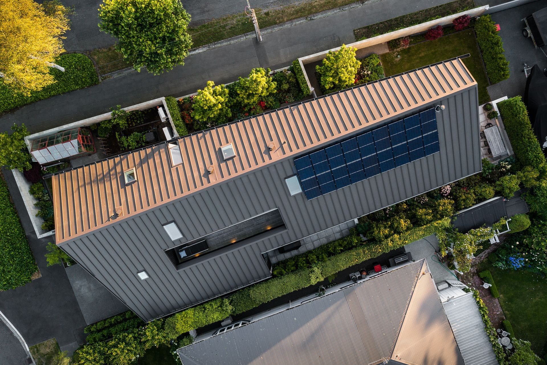 To accomodate the small site and add a bit of architectural flair, the roof pitch was designed to be unbalanced.