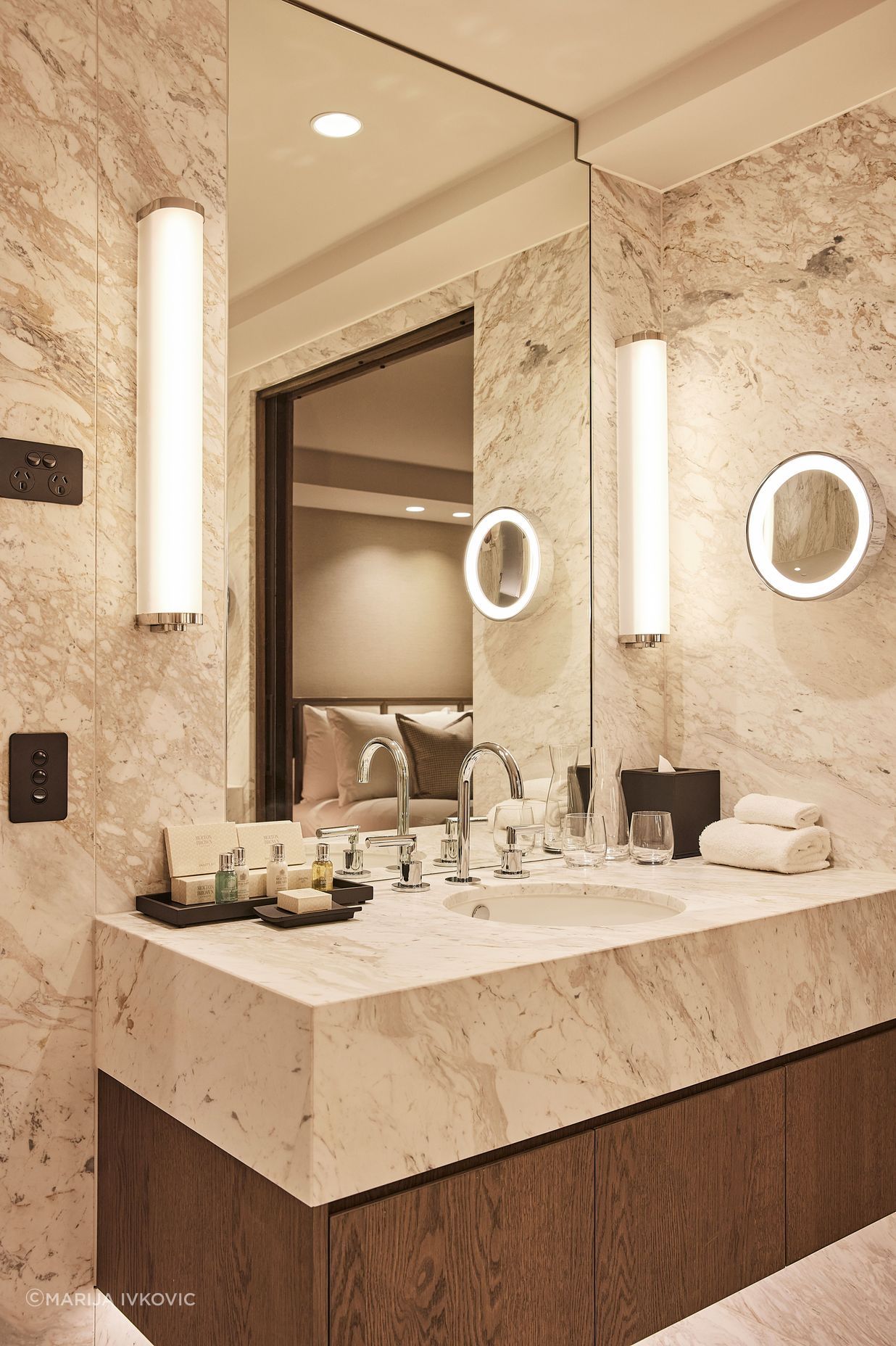 The hotel's rooms' ensuites are palatial in size and feature soft marble, contrasted against rich oak veneer.