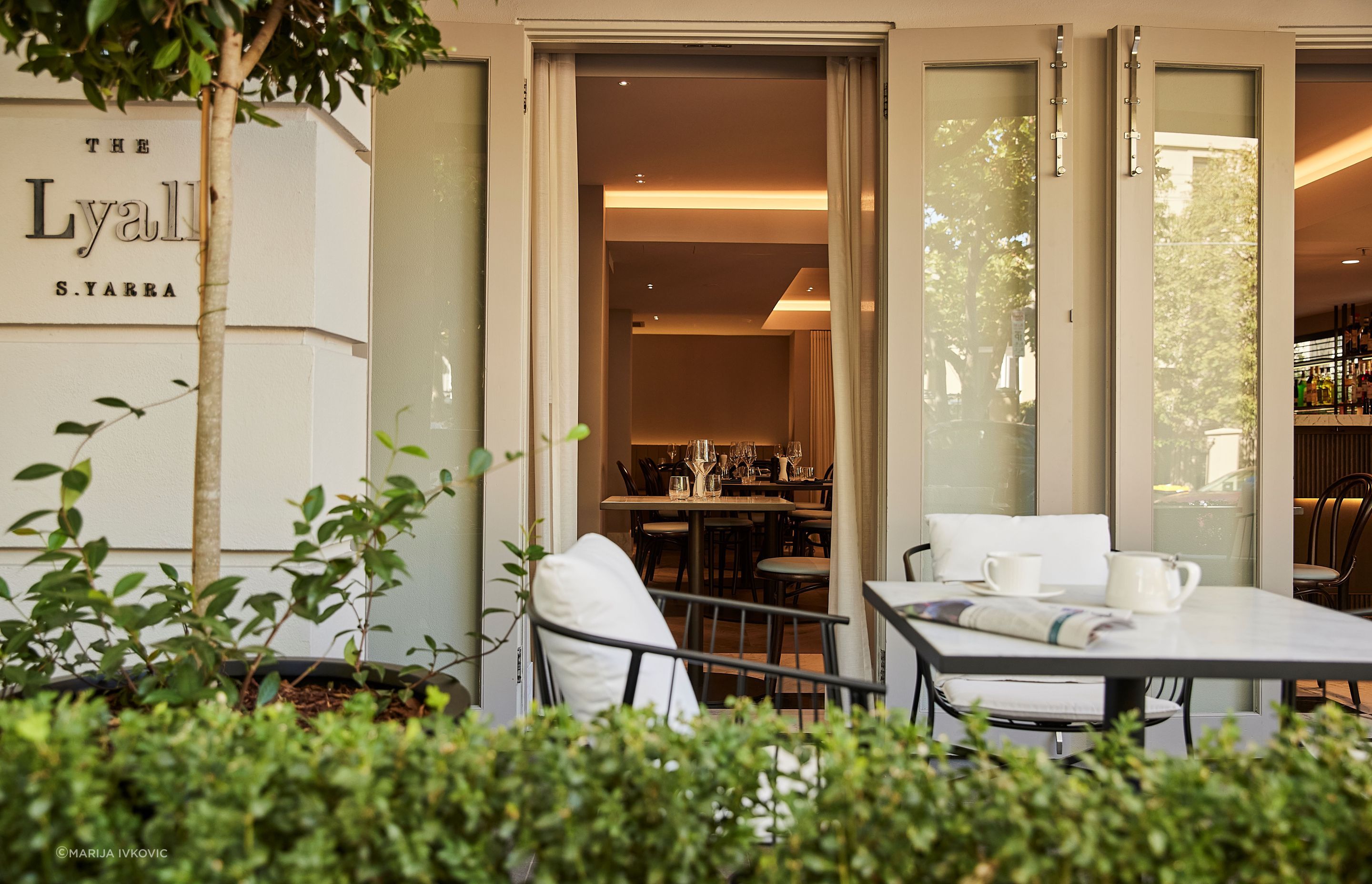 The entry to The Lyall passes by the al fresco dining area, leading guests into the soft lighting and serene colour palette that is the foundation of the luxurious yet cosy feeling throughout the hotel.