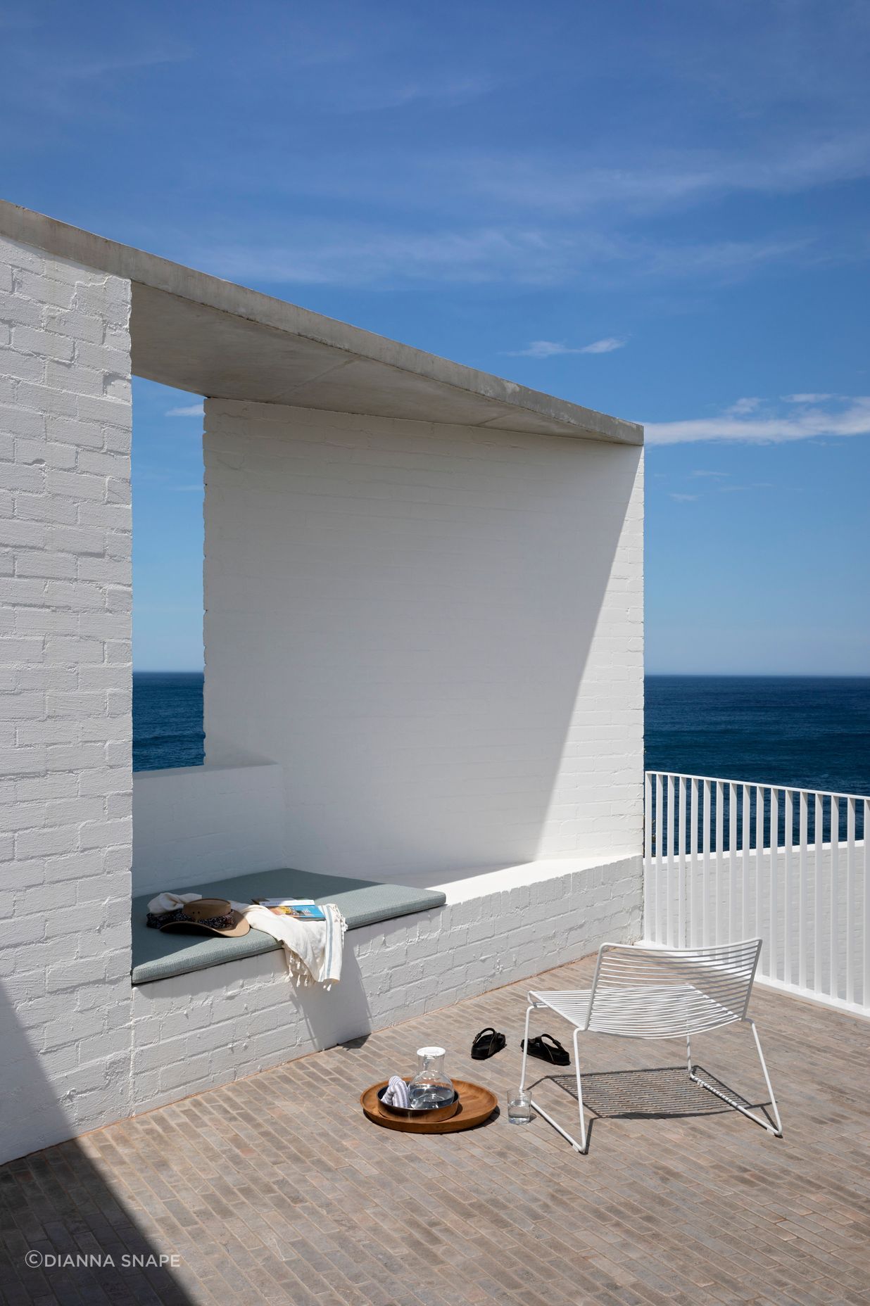 The generous terrace on the top floor features a built in daybed where the owner can enjoy the warm sunny days.