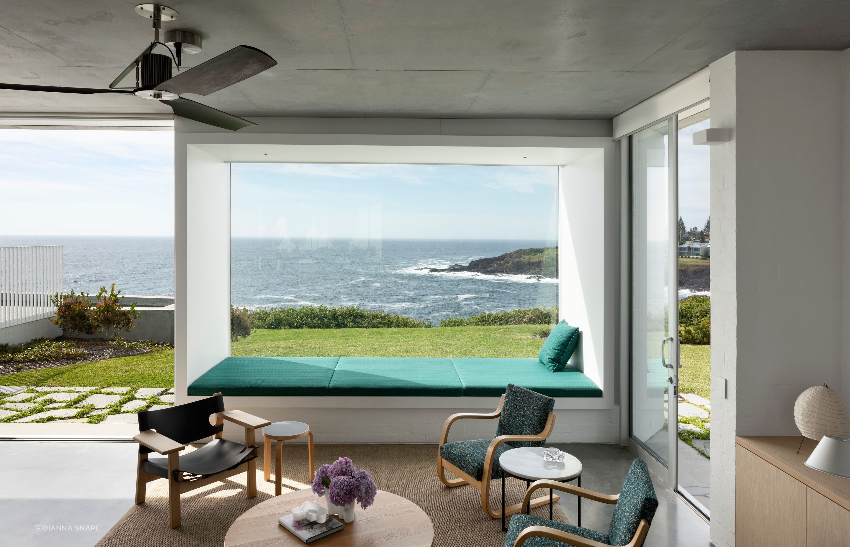 In the sunken lounge a built-in daybed is the perfect spot to enjoy the wild storms that frequently pass through.