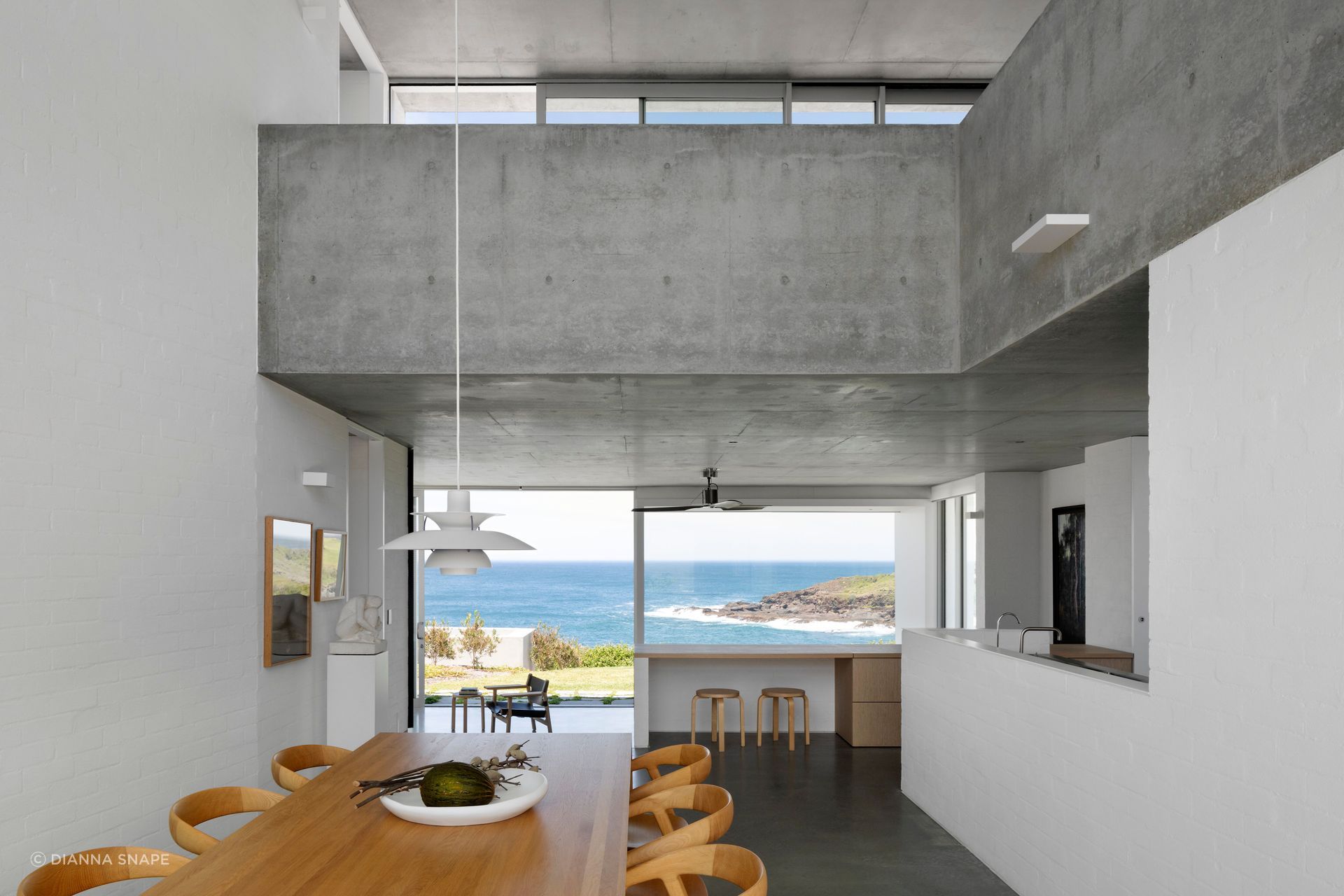 The living spaces enjoy a picture window view of the coast.