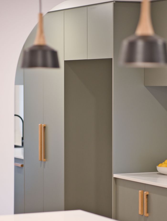 "Everyone wants that coastal feel, and they’ve done this in a modern way with flat kitchen cupboard panels and sage green which makes a big impact."