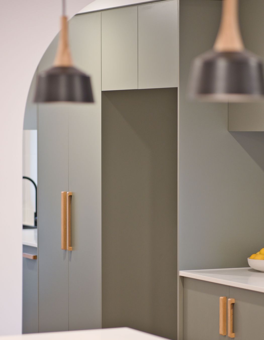 "Everyone wants that coastal feel, and they’ve done this in a modern way with flat kitchen cupboard panels and sage green which makes a big impact."