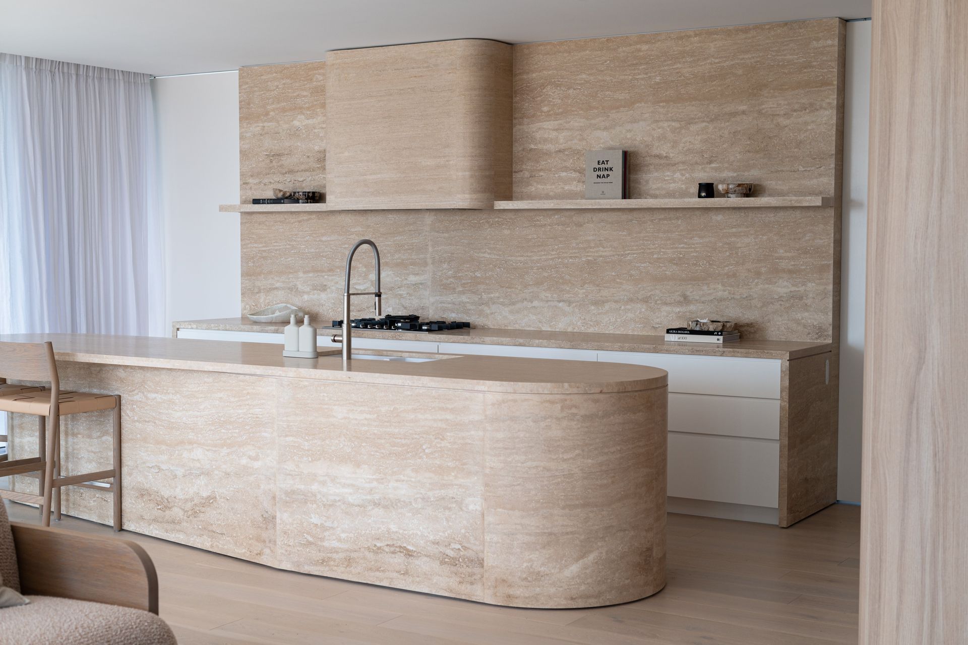Neutral tones and curves for modern kitchens.