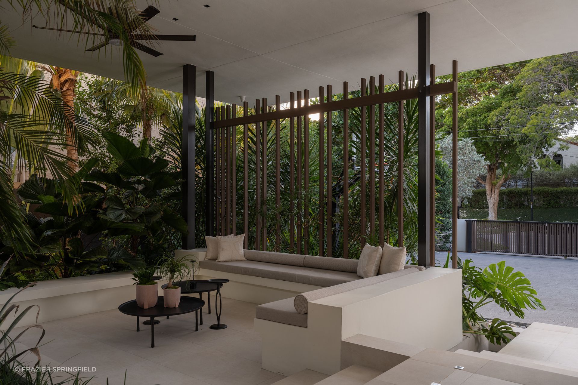 Wood battens filter the street side for privacy at KODA's Miami project.