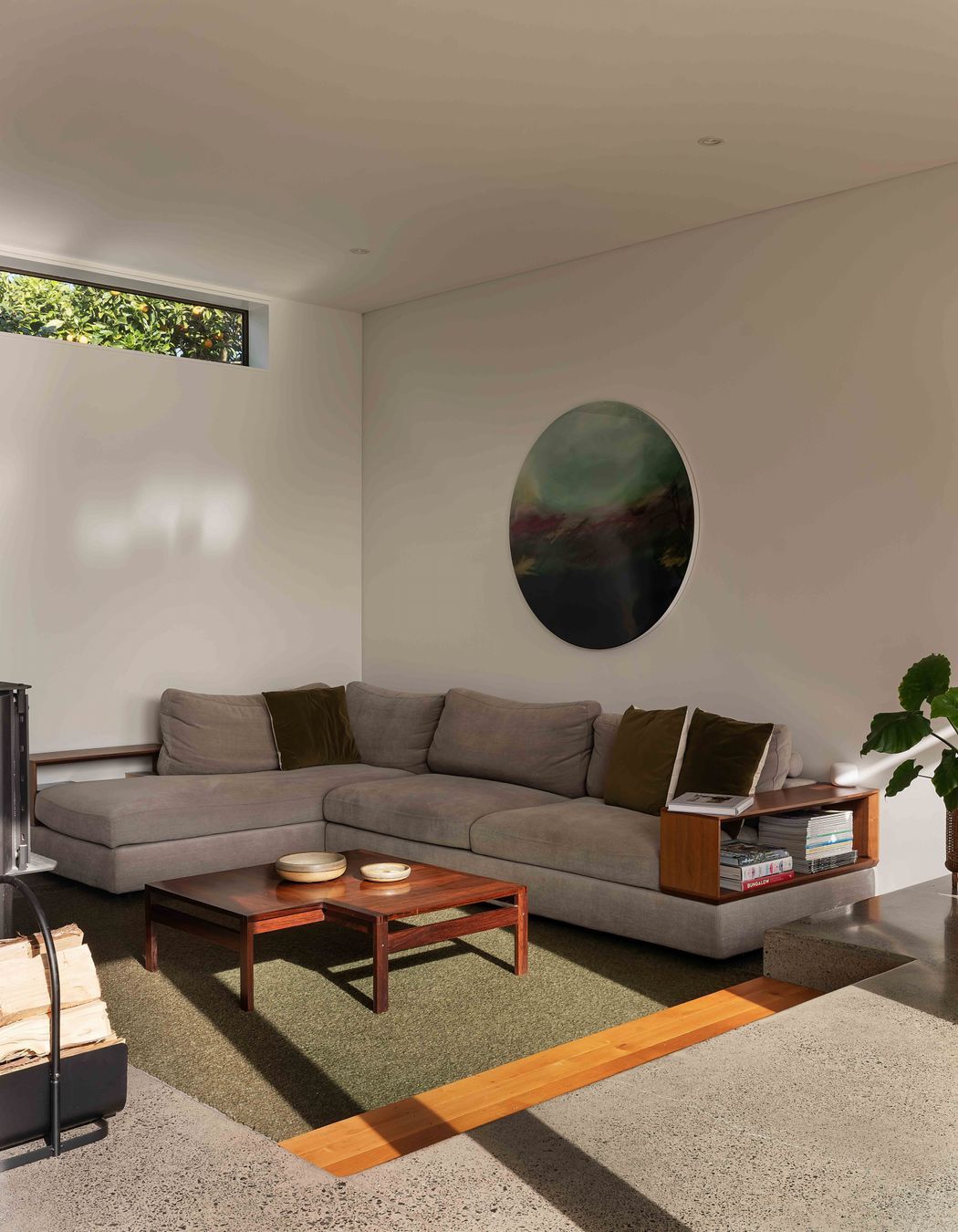 The conversation pit is formed into the concrete foundation.