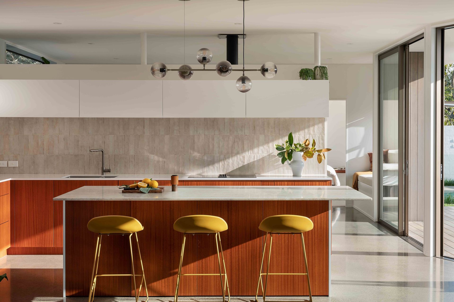 The kitchen was designed with a strong mid-century aesthetic.