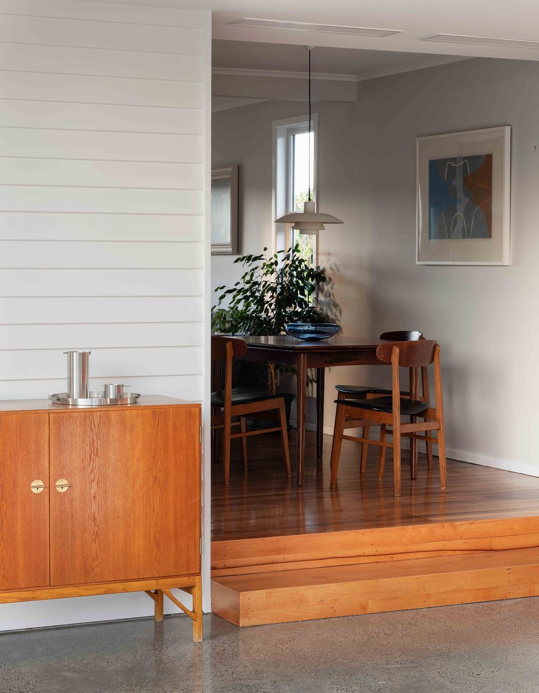 The new extension is a step down from the original house.