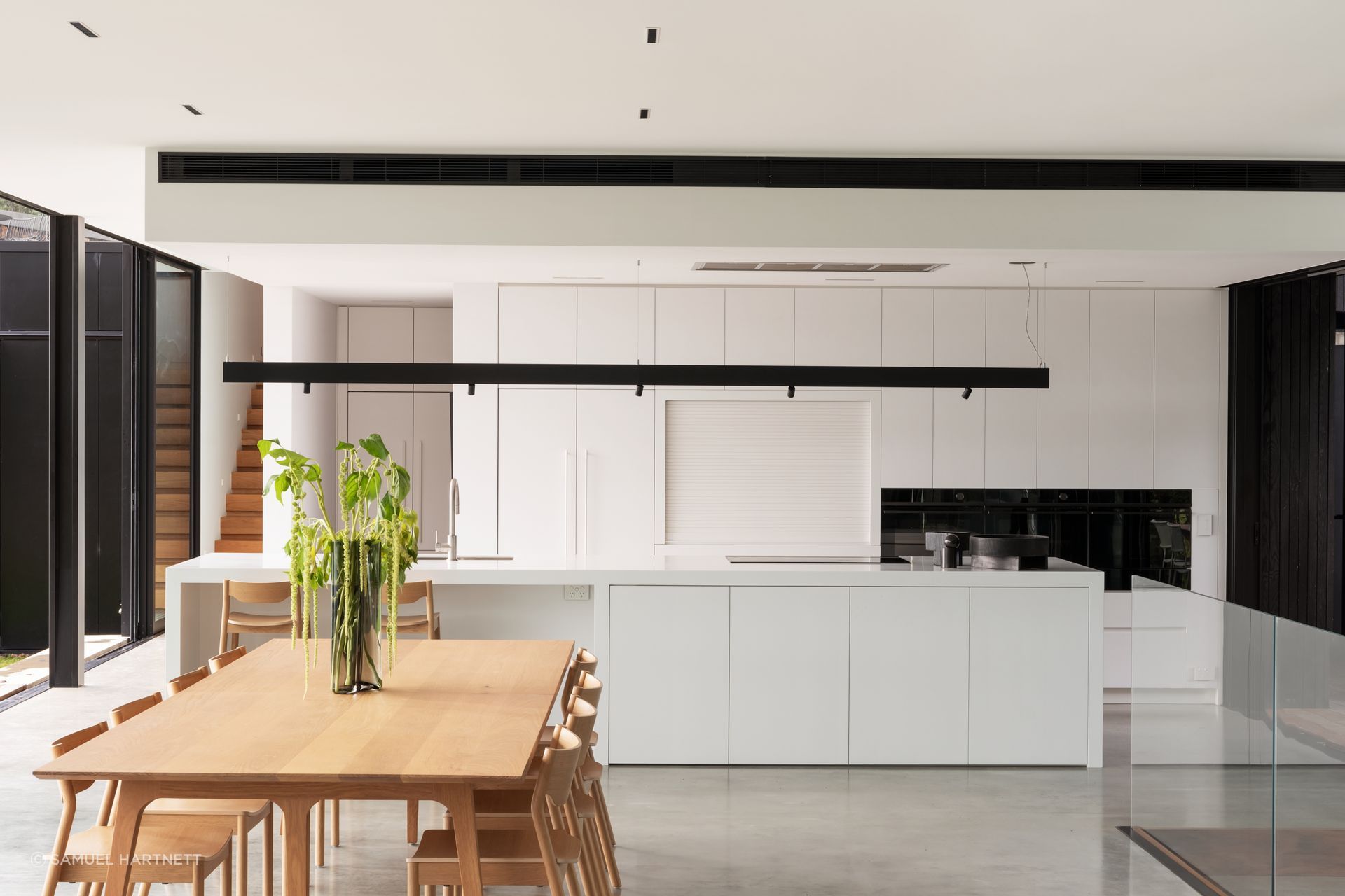 Daniel designed the kitchen to suit the client’s low-key approach. Most appliances are Fisher & Paykel. The Swiss kitchen mixer is from Plumbline, and the benchtops are Corian.