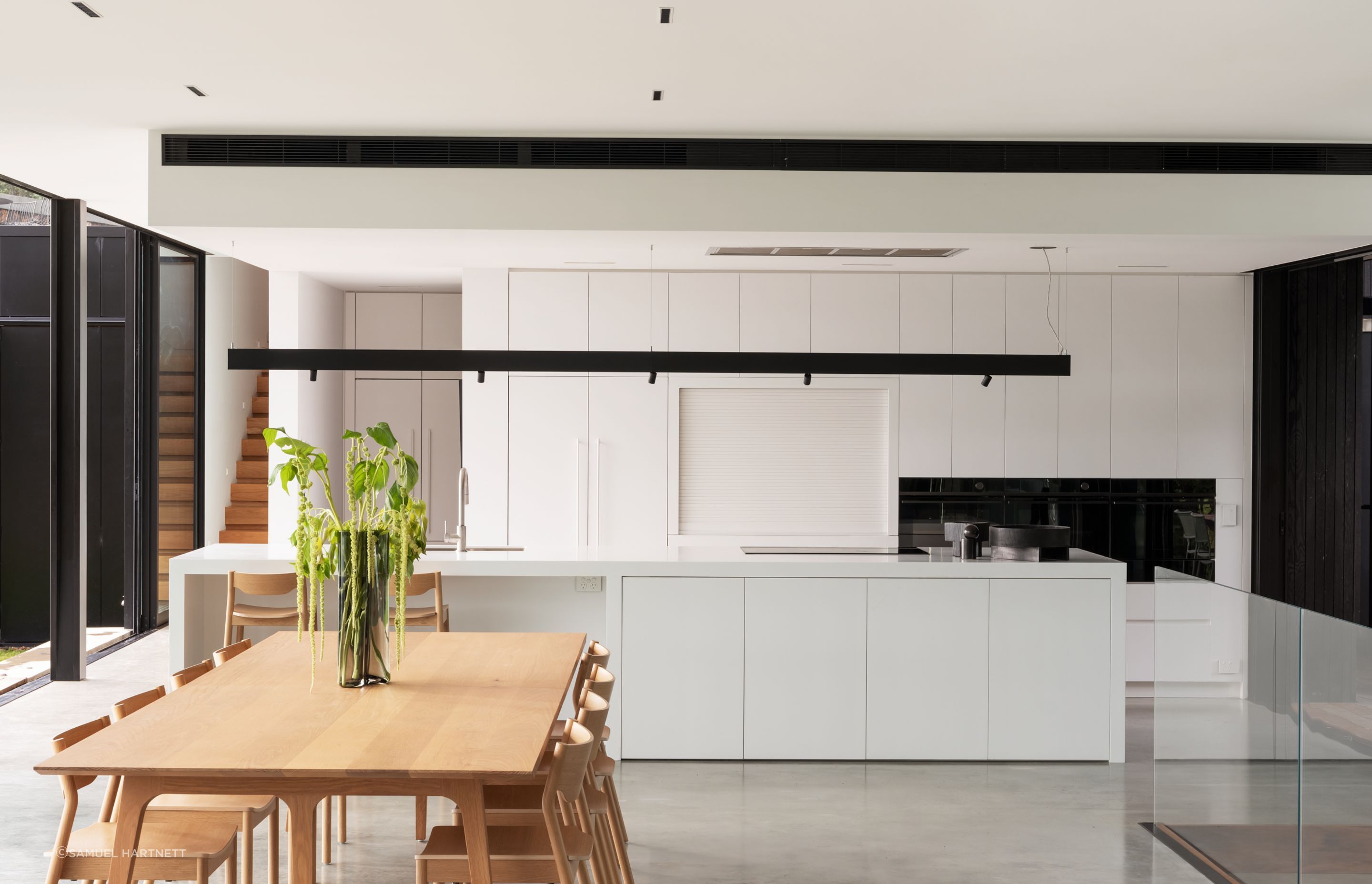 Daniel designed the kitchen to suit the client’s low-key approach. Most appliances are Fisher &amp; Paykel. The Swiss kitchen mixer is from Plumbline, and the benchtops are Corian.