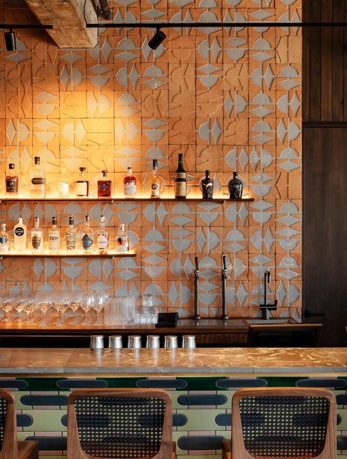 The length of the restaurant, a wall of clay terracotta tiles brings warmth to the interior and a unique Spanish flavour.