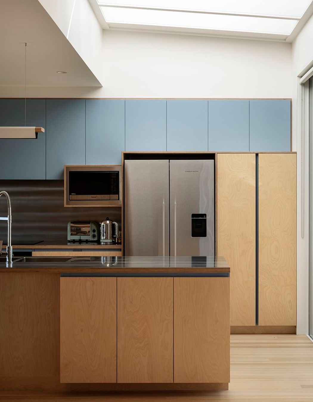 The light-filled residence has a calming, joyful spatial experience.