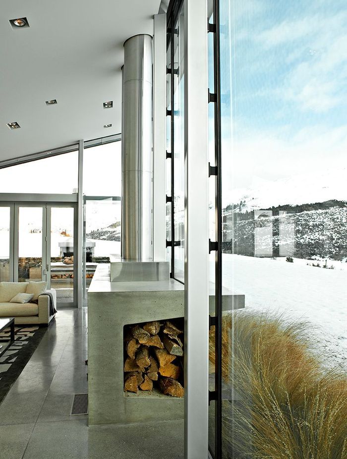 An innovative use of a farm trough with this stylish fireplace.