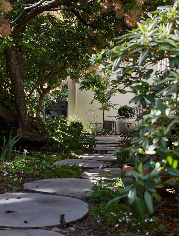 Multiple elements of the landscaping contribute to the Mediterranean feel.