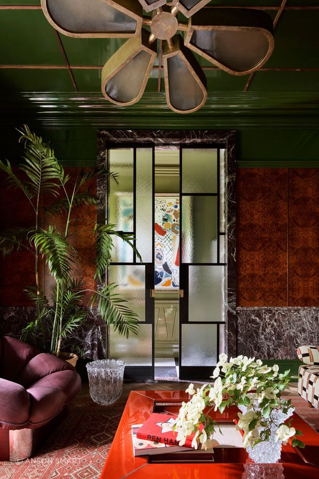 A custom sliding door ensures light and privacy in the sitting room.