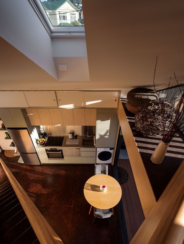 The mezzanine floor is a clever bonus space that allows room for a guest to stay and a spot to use as a study.