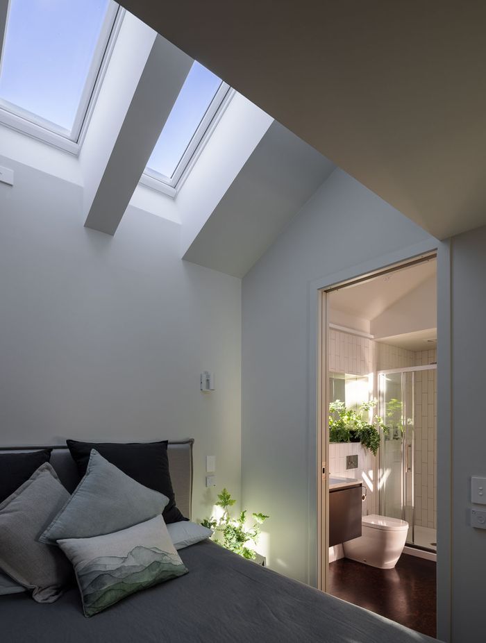 In the ground floor bedroom, skylights allow light in without impacting privacy.
