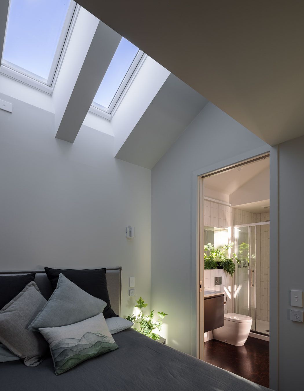 In the ground floor bedroom, skylights allow light in without impacting privacy.