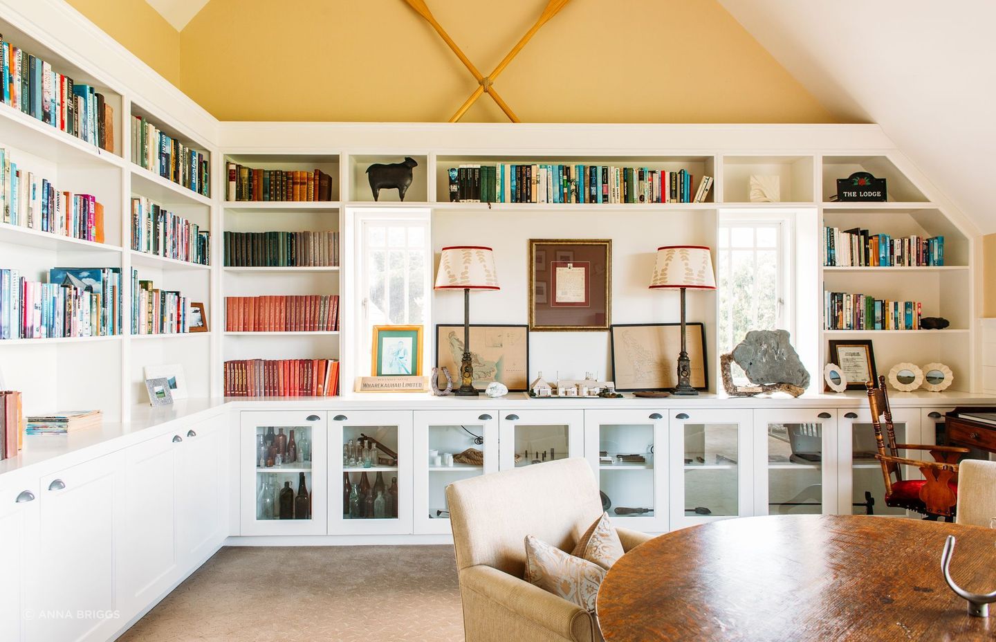 The library is decorated with warm colours to counteract the unusual light in the area thanks to the wide outlooks of sea and sky, says Nikki. “It's a nice little space with a fireplace where you can tuck yourself away.”