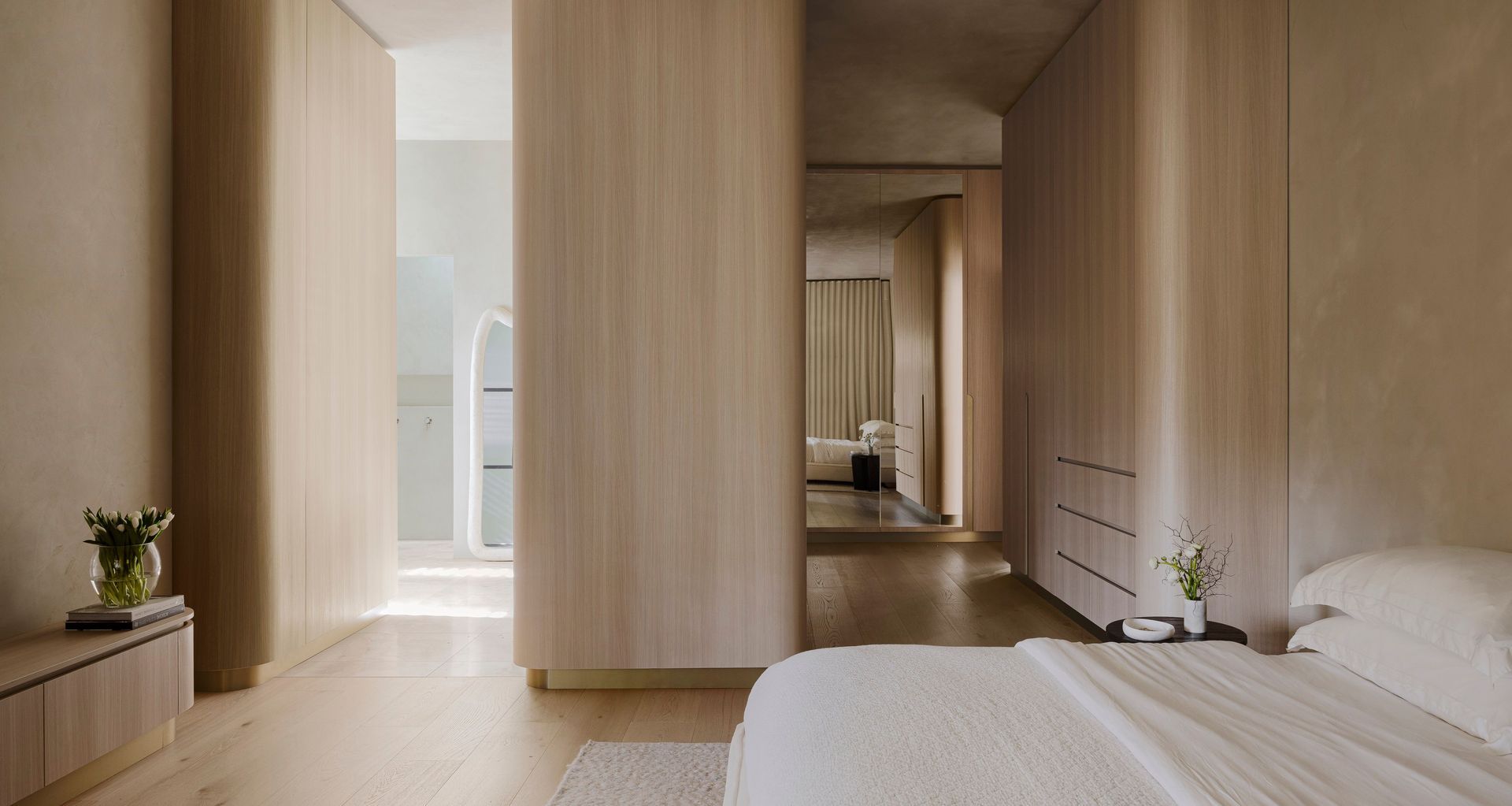 The AMMOS Residence in South Australia embraces curves and timber veneers at every turn.