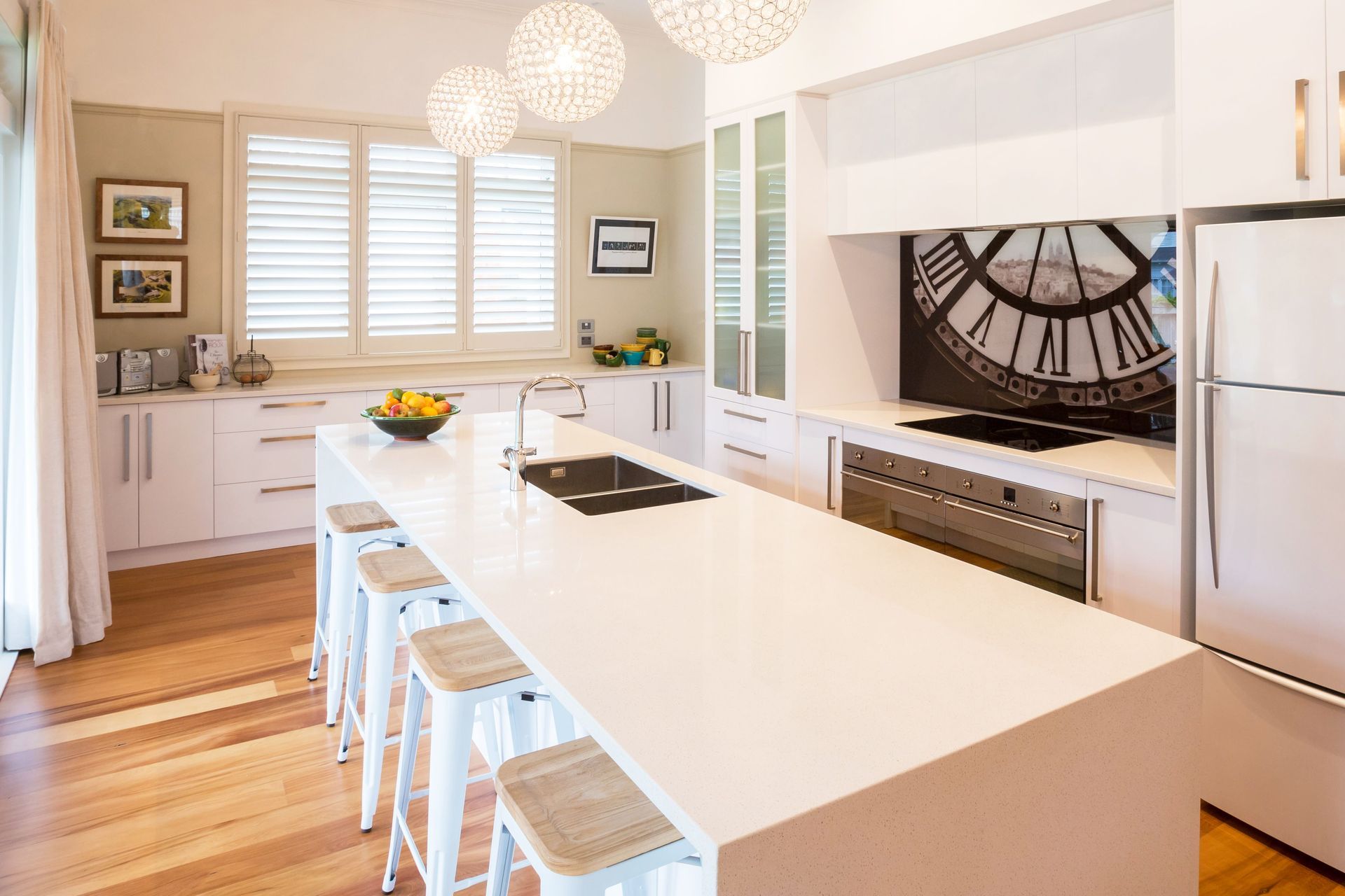 Timber flooring and warm accents create comfortable living spaces inside the home.