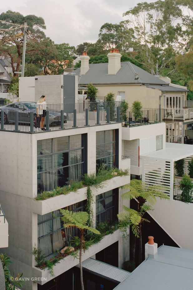 The off form concrete tower connects with the original house through a glazed corridor.