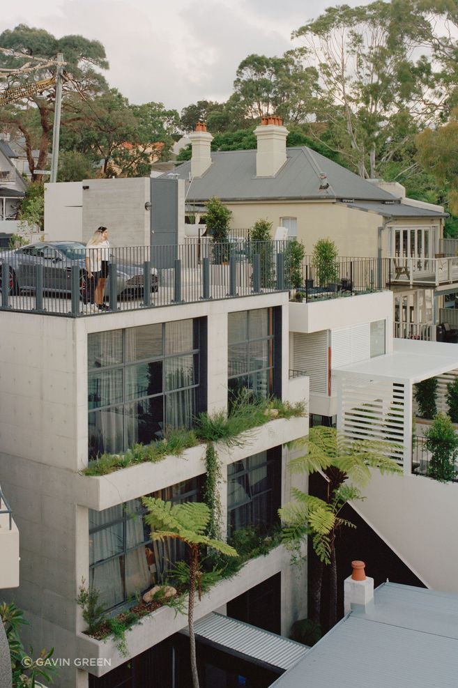 The off form concrete tower connects with the original house through a glazed corridor.