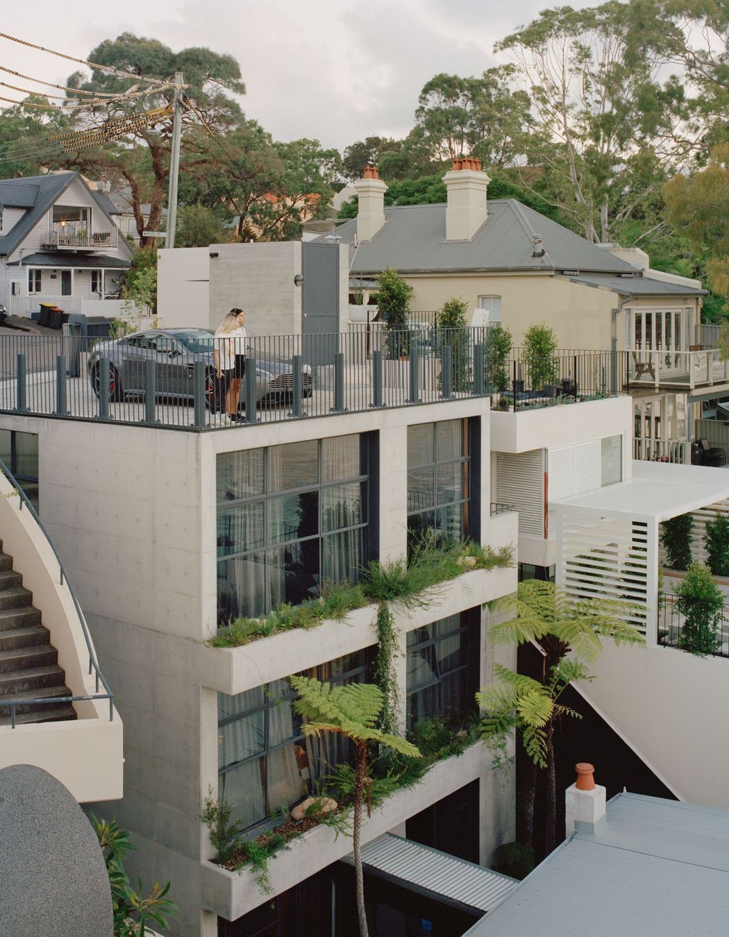 The off form concrete tower connects with the original house through a glazed corridor.