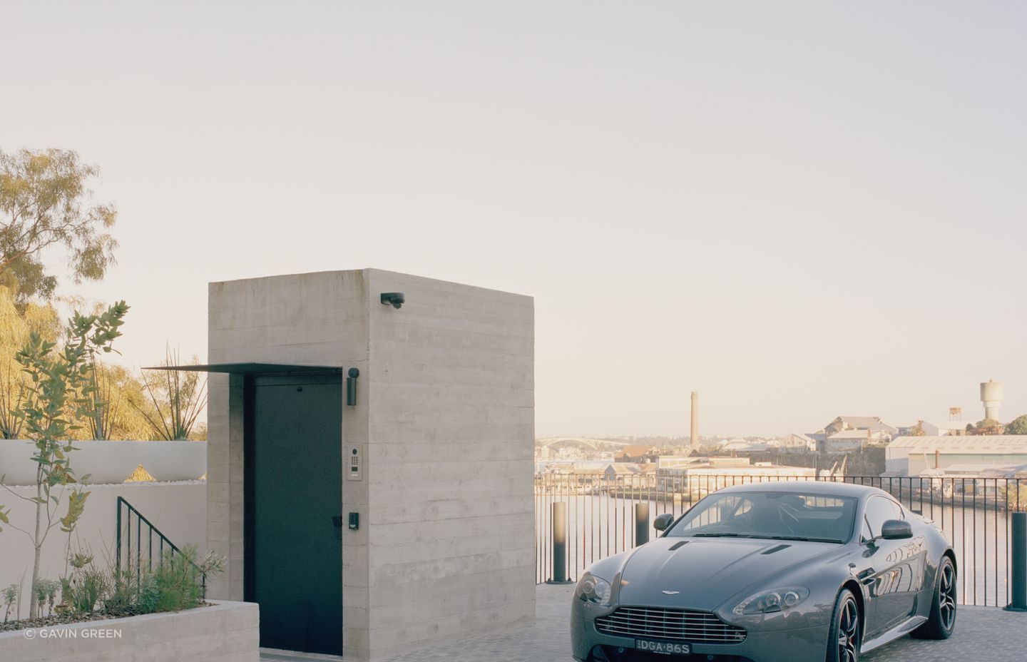 The lift protruding from the concrete form at street level is the only indication of the jaw-dropping structure below.
