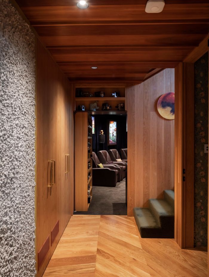 “The movie theatre is a large component of the downstairs area. It’s through a hidden bookshelf door. That was a really fun process,” says Brad. All the theatre fittings came from the Green family’s previous home.