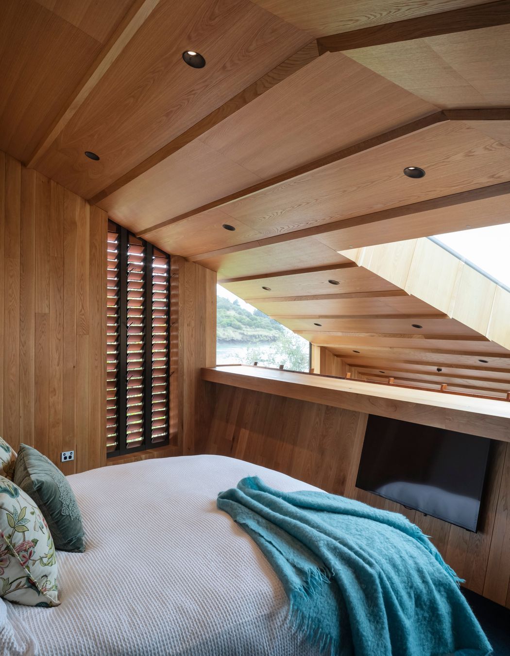 The home has three bedrooms and three and a half bathrooms. Because each bedroom has an en suite the family hadn't decided whose room was whose through the process. “The one on the mezzanine above the kitchen is now the main bedroom,” says Brad.