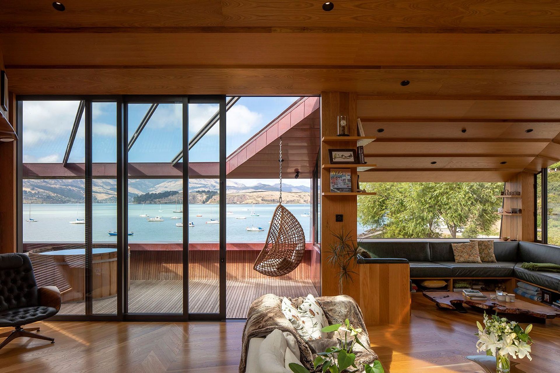 The Green family had long wanted to live in Lyttelton’s Cass Bay. The decorative parquet flooring is a representation of the mountainous ridgeline behind the home – JSC Timber supplied all timber finishes for the home. The spa on the deck is from Colonial Hot Tubs.