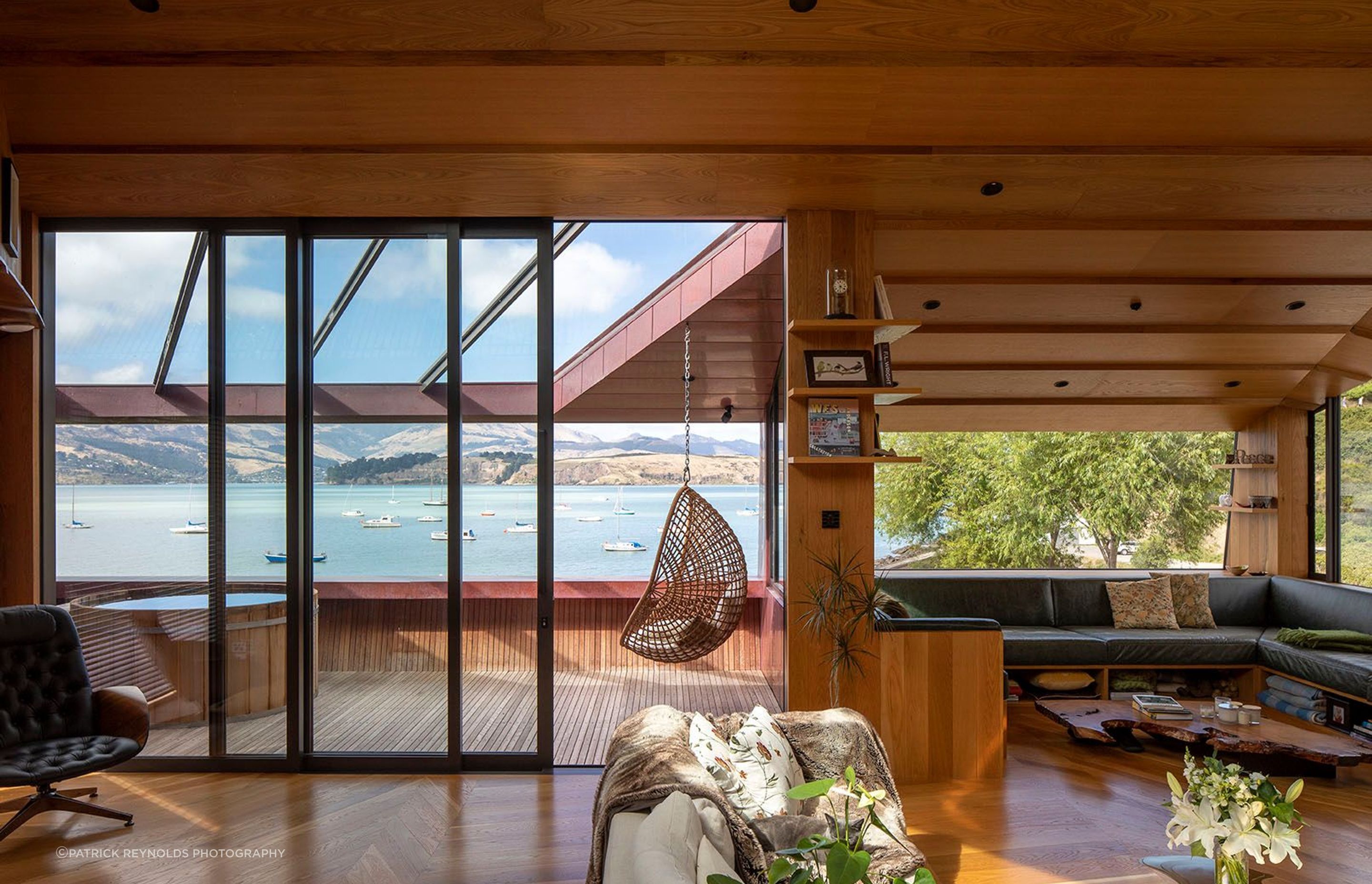 The Green family had long wanted to live in Lyttelton’s Cass Bay. The decorative parquet flooring is a representation of the mountainous ridgeline behind the home – JSC Timber supplied all timber finishes for the home. The spa on the deck is from Colonial Hot Tubs.