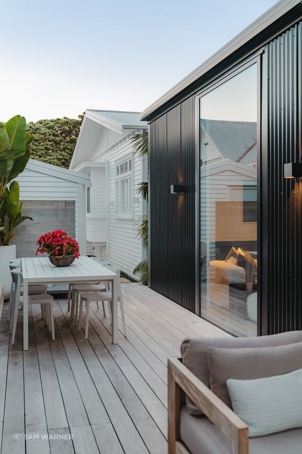 There is a pleasant synchronicity between the original character bungalow and the sharp, contemporary extension.